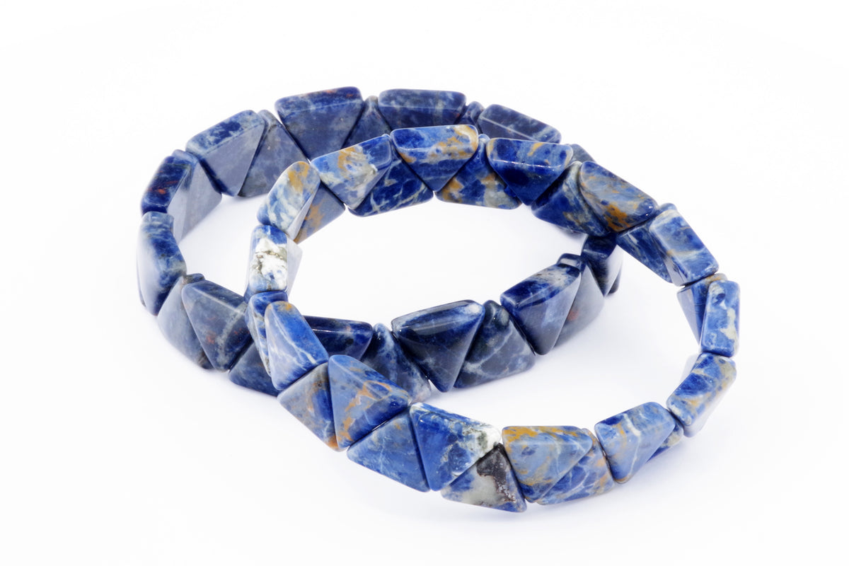Sodalite bracelet – Triangle featuring polished deep blue natural crystals with white and golden mineral patterns, designed as triangular gemstone beads for a unique crystal jewellery piece.