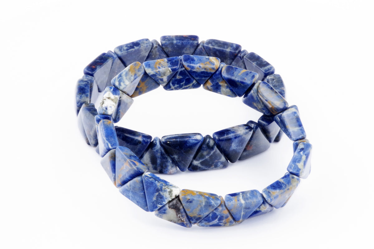 Close-up of blue natural sodalite gemstone beads shaped as triangles, arranged in a double-strand Sodalite bracelet – Triangle with polished surfaces for crystal jewellery and healing purposes.
