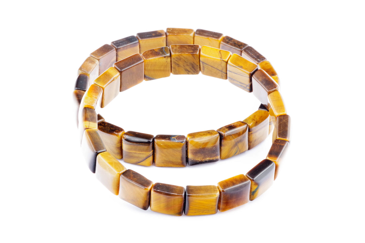 A Tiger eye bracelet – Square made of polished natural tiger's eye gemstone squares in brown and golden hues, arranged in a continuous strand showcasing the stone's distinctive chatoyancy.