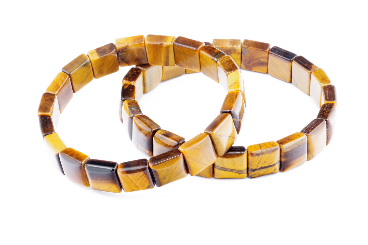 Two natural gemstone crystal bracelets featuring polished square tiger eye beads, showcasing warm golden and brown hues in the Tiger eye bracelet – Square style.