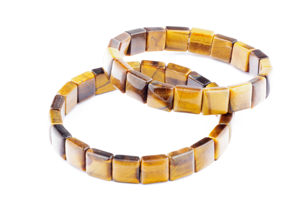 Two polished crystal bracelets made of square tiger's eye gemstones, showcasing rich golden and brown natural hues, known as Tiger eye bracelet – Square.