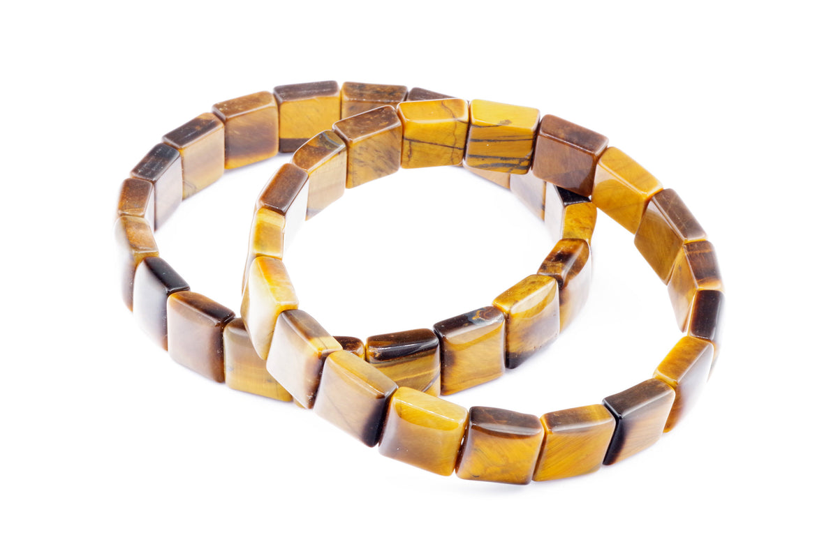 Two polished natural tiger's eye crystal bracelets featuring square beads with golden brown and dark brown banding, known as Tiger eye bracelet – Square.
