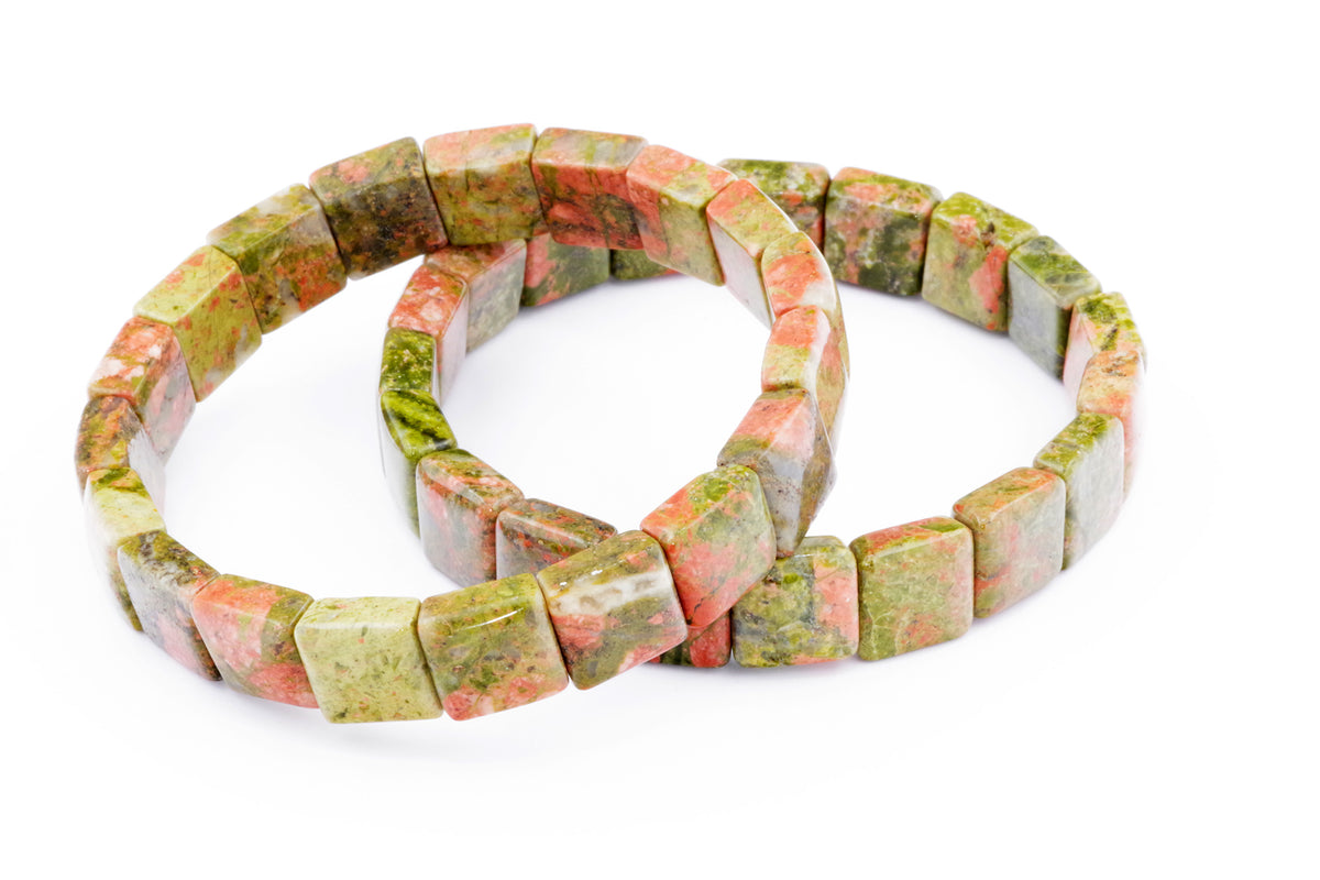 Two Unakite bracelet – Square pieces made from natural multicolored green and pink polished crystal gemstones arranged on a white background for crystal bracelets lovers and healing crystals enthusiasts.