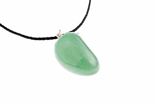 A smooth, light green pebble pendant hangs from a black cord against a white background.