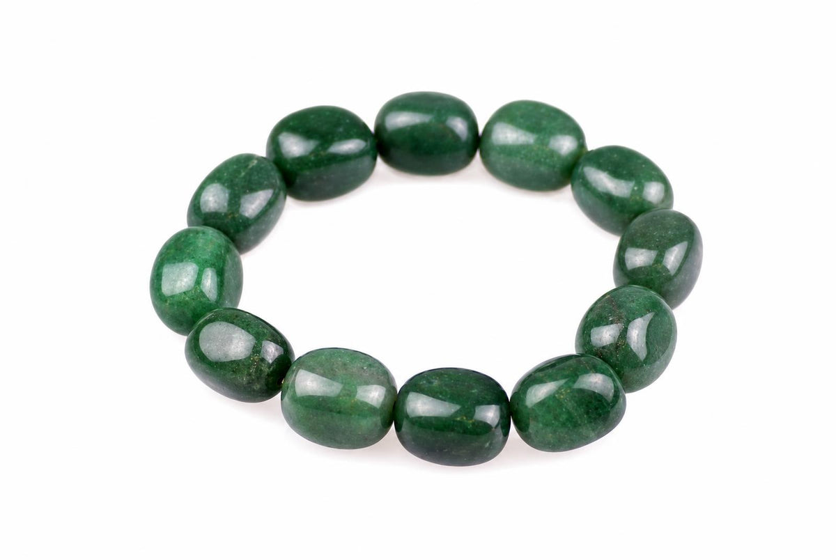 Glossy green bracelet with rounded oval beads arranged in a ring on a white background, viewed from slightly above.