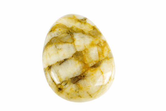 A polished, oval-shaped feldspar pendant with a white and yellow-brown patterned surface on a plain background.