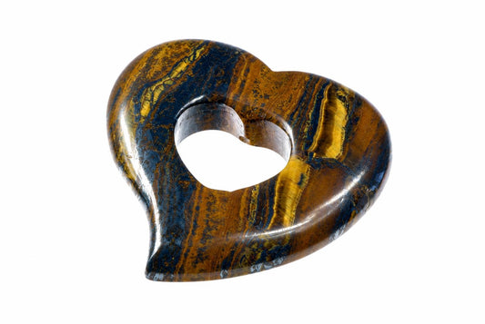 A polished heart pendant with an open heart-shaped center has brown, gold-colored and dark bands against a white background.