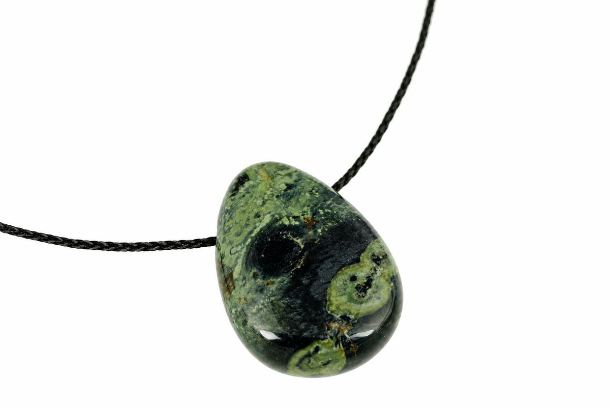 A polished pendant with a teardrop shape, featuring dark green and black mottled patterns on a white background.