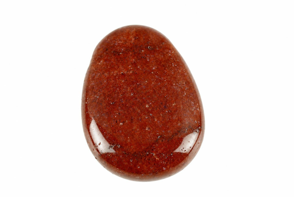 A polished, teardrop-shaped stone with a deep red-brown surface and small speckles, set against a white background.