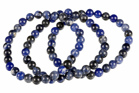 A coiled bracelet of round beads in dark blue, black and grey tones on a white background.