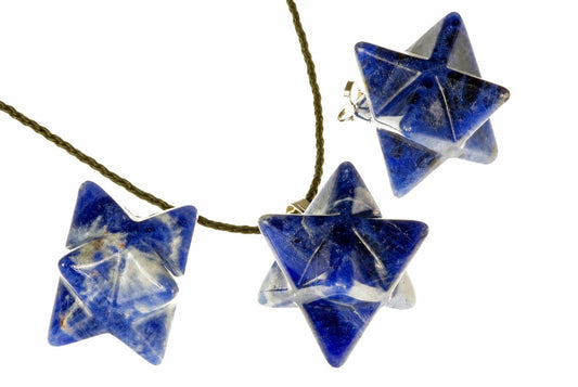 Three blue sodalite star-shaped pendants hang from a dark cord against a white background.