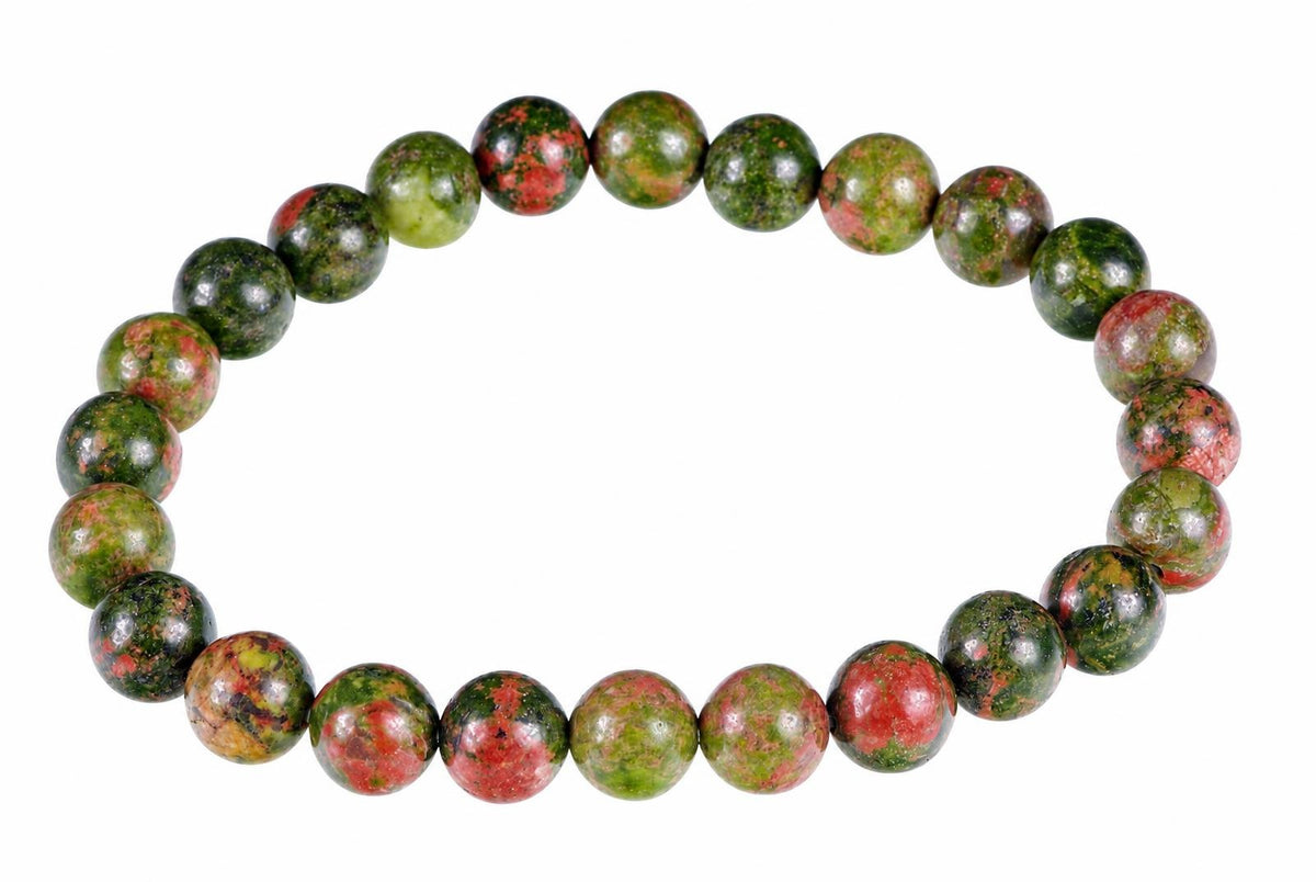 A bracelet of round beads with green, red and black speckled patterns on a white background.