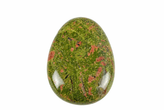 A polished, oval-shaped stone with a green base and red speckles on a white background.