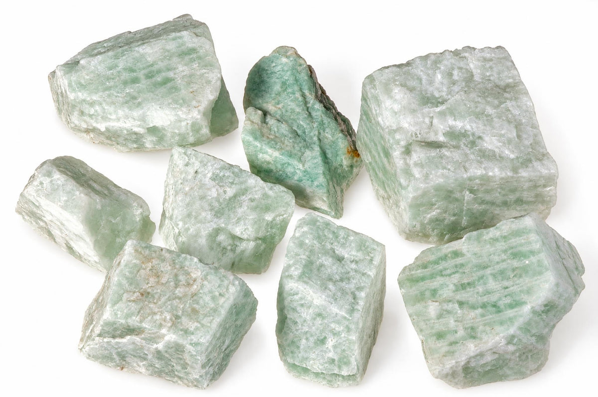 Eight raw Amazonite stones in pale green and white, arranged on a plain white surface.