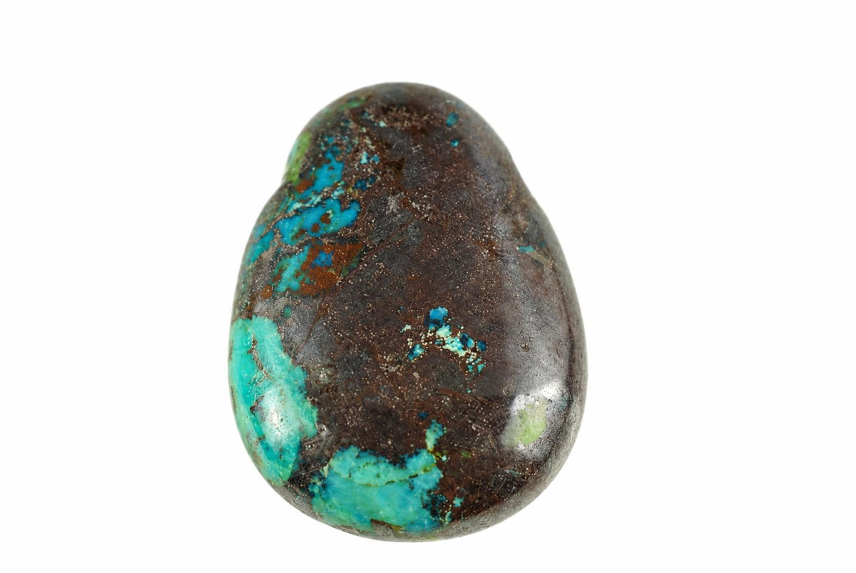 A polished teardrop chrysocolla pendant has vivid blue and green patches across a dark brown surface against a plain white background.