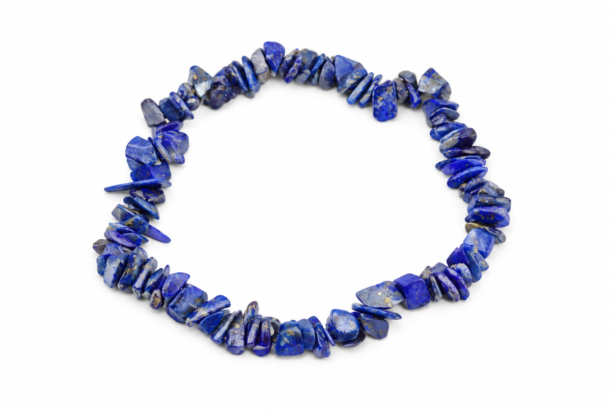 A bracelet of irregular blue stone chips with pale and gold-toned flecks forms a loop on a white background.
