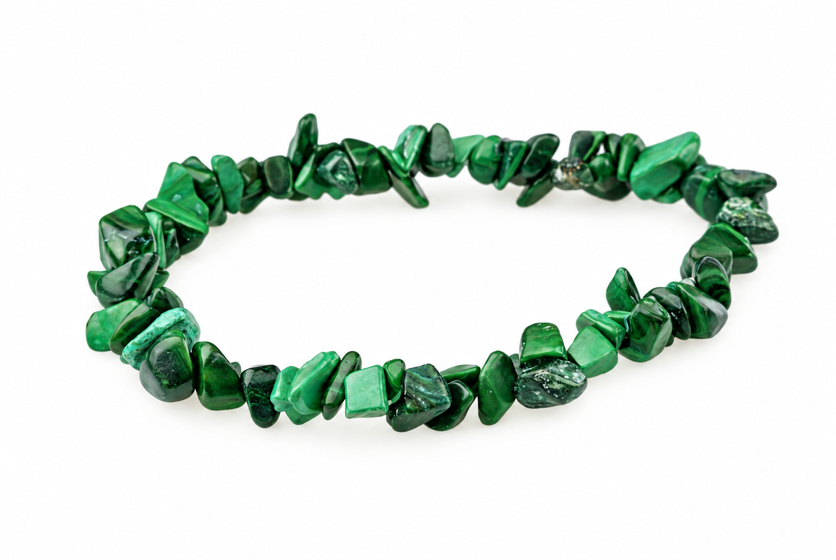 A bracelet made of irregular green malachite chips arranged in a circle on a white surface.