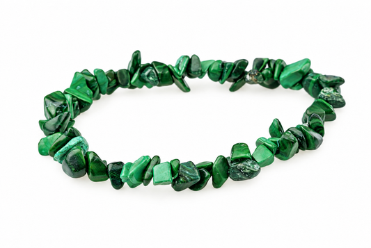 A bracelet made of irregular green malachite chips arranged in a circle on a white surface.