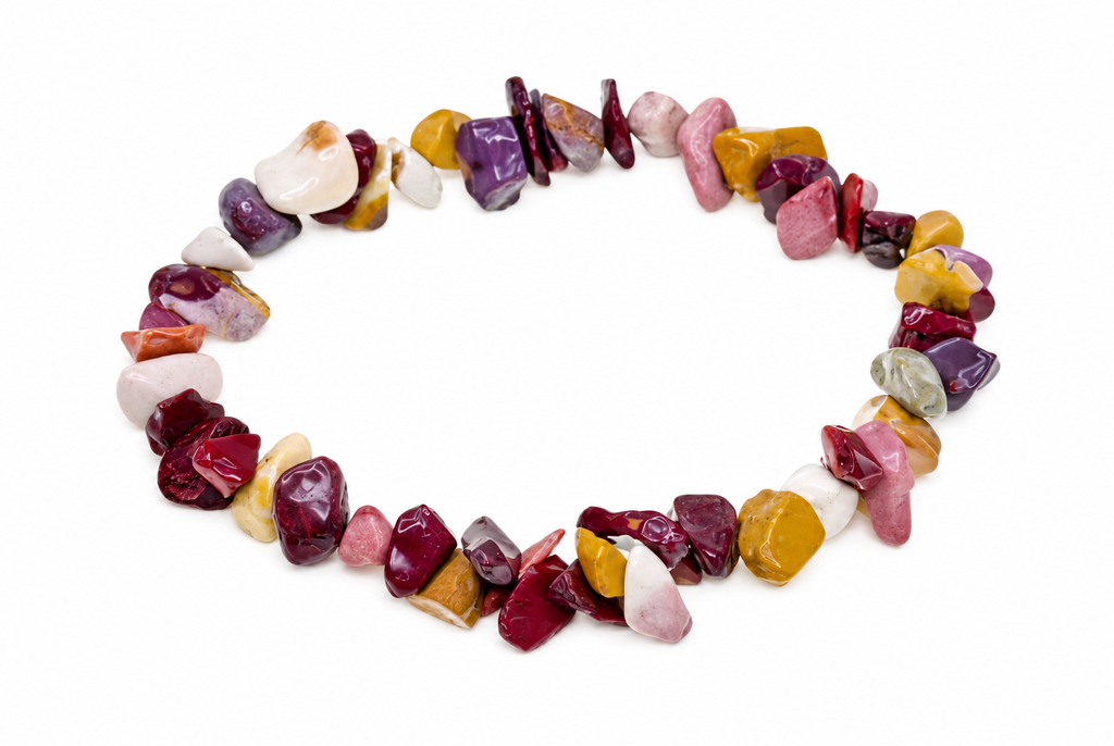 A bracelet made of polished, irregular chips in red, purple, yellow, white and pink stones on a white background.