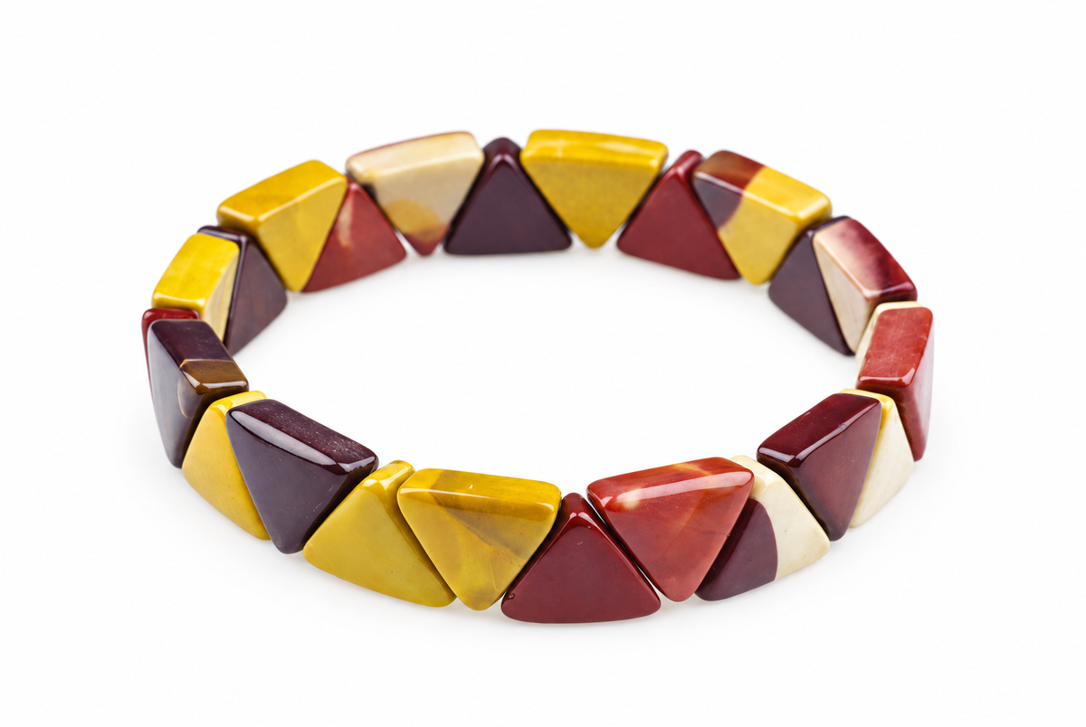 A bracelet made of triangular beads in yellow, red, cream and dark brown tones on a white background.