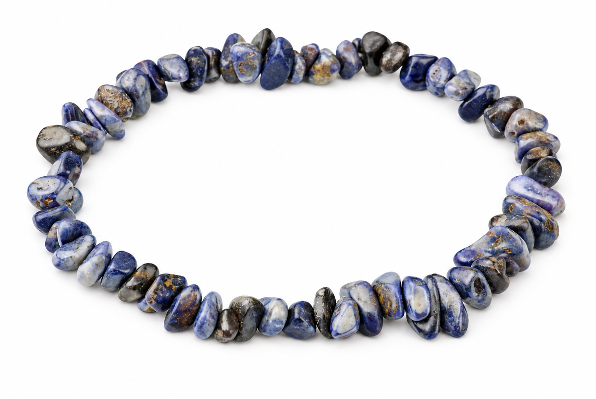A bracelet of irregular polished blue, grey and white stone chips with brown flecks forms a loop on white.