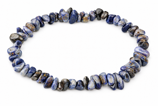 A bracelet of irregular polished blue, grey and white stone chips with brown flecks forms a loop on white.