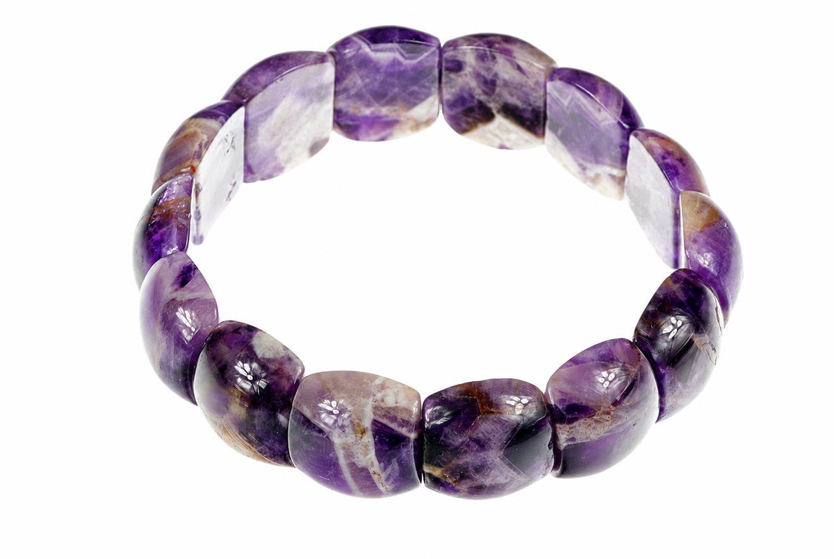 A bracelet made of polished, irregularly shaped beads in shades of purple, white and brown on a white background.