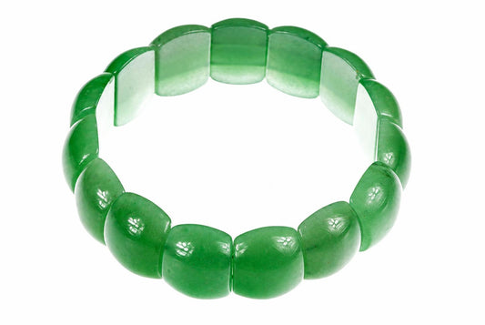 A green aventurine bracelet with smooth, rounded segments arranged in a circle on a white surface.