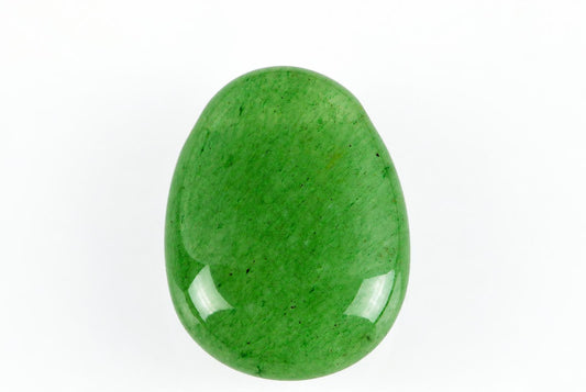 A polished, oval-shaped green aventurine stone with a smooth surface and small dark specks on a white background.