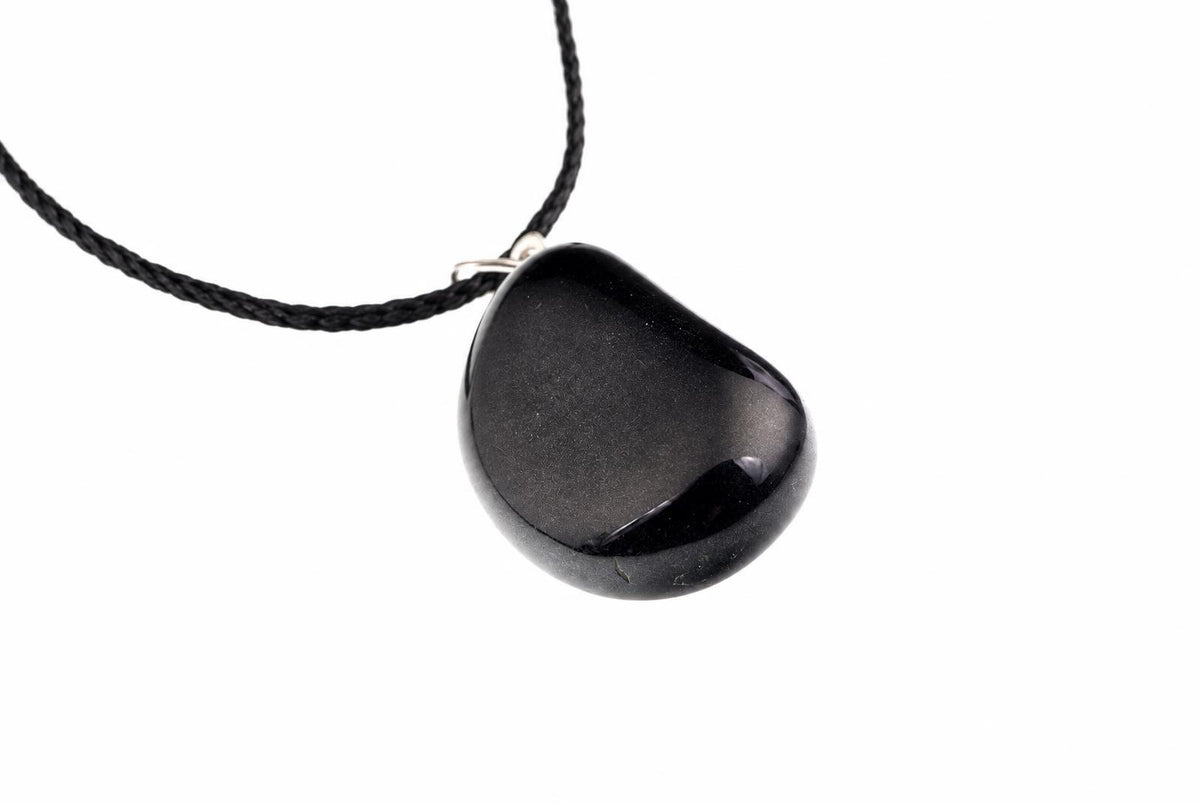 A black, smooth, teardrop-shaped pendant hangs from a braided black cord against a white background.