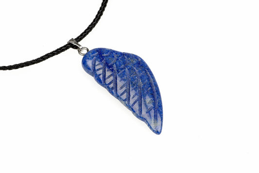 A blue quartz wing pendant has carved feather lines and a silver toned loop, attached to a black cord against white.