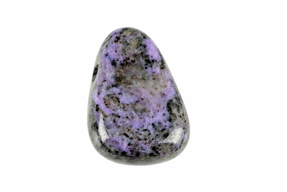A polished Charoite pendant with purple, grey and black speckled patterns on a white background.
