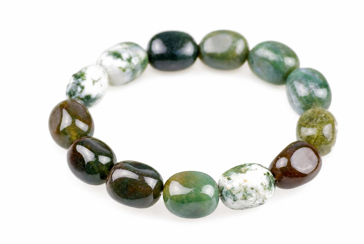 Bracelet of glossy, rounded green, brown and milky-white beads with mottled markings, arranged in an oval on a white background and viewed at a slight angle.