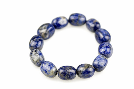 Bracelet of polished rounded blue beads with mottled white and grey markings, arranged in an oval on a white background and viewed from above at a slight angle.