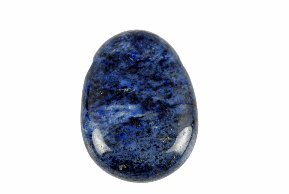 A polished, oval dumortierite pendant with deep blue and black speckled patterns on a white background.