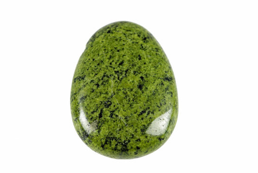 A polished, egg-shaped stone with a bright green surface speckled with black spots, set against a white background.