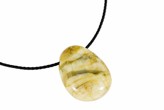 A polished, oval-shaped pendant with cream and yellow-brown stripes hangs from a black cord against a white background.