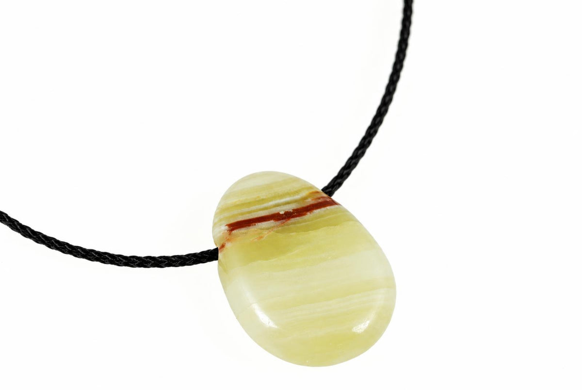 A polished pendant with pale yellow and white stripes, a dark brown band, on a black cord against a white background.