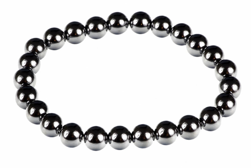 A bracelet made of round, dark metallic beads with a silver-toned finish arranged in a circle on a white background.