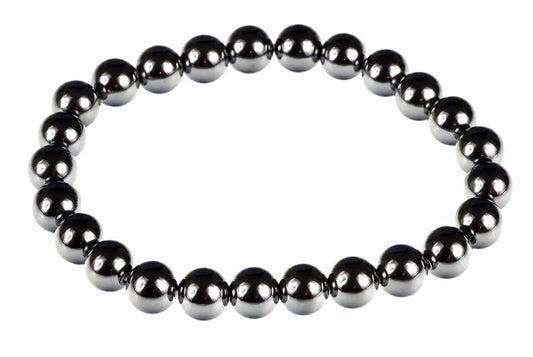 A bracelet made of round, dark metallic beads with a silver-toned finish arranged in a circle on a white background.