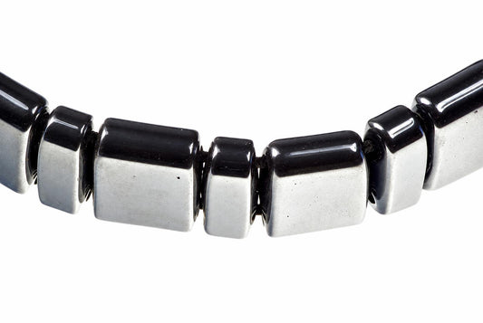 A bracelet with alternating square beads of black and silver-toned material on a white background.