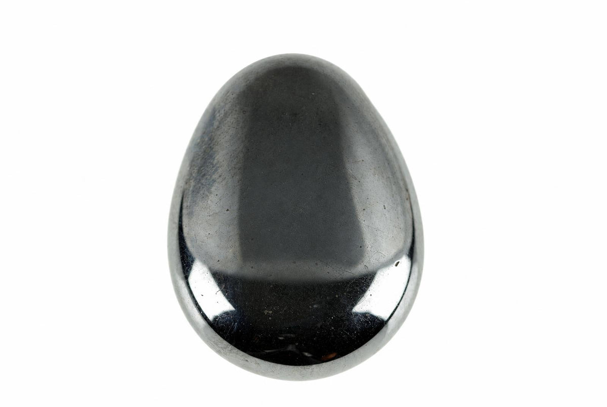 A polished hematite drop pendant has a smooth dark grey face with bright reflections along its rounded lower edge.