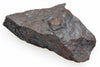 A dark grey, rough-textured rock with brown rust spots and a white background.