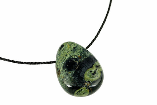 A polished pendant with a teardrop shape, featuring dark green and black mottled patterns on a white background.