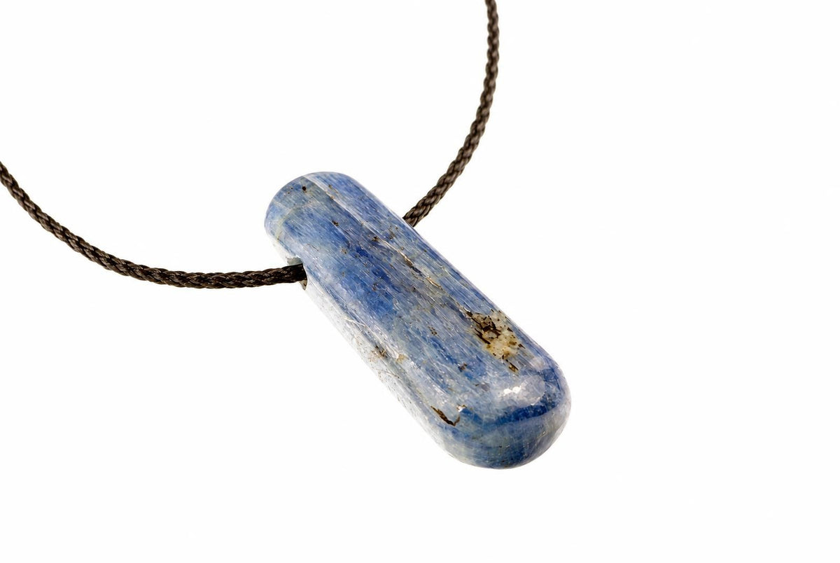 A blue and white kyanite pendant on a dark brown cord, set against a plain white background.