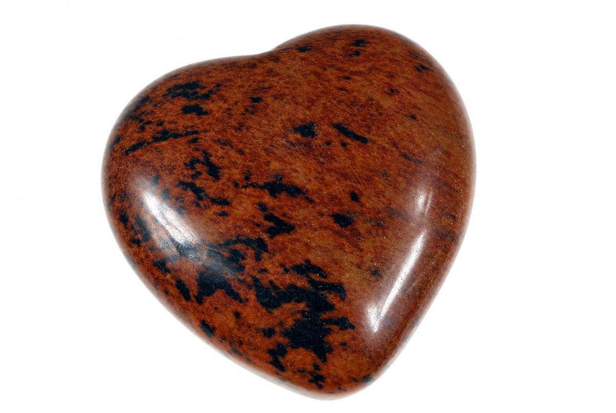A polished heart-shaped stone with a brown surface and dark black markings, set against a white background.