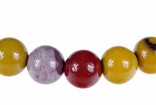 A row of five round beads in yellow, purple, red and yellow-brown on a white background.