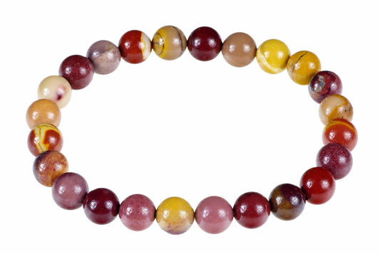 A bracelet of round beads in red, yellow, brown and cream tones arranged on a white background.