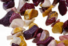 A bracelet made of polished, irregular chips in dark red, cream, yellow and brown tones on a white background.