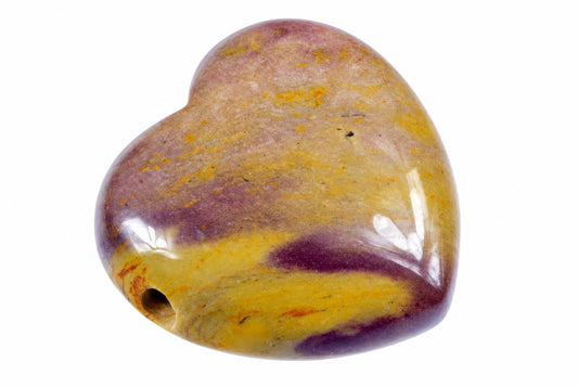 A polished heart-shaped stone pendant with purple, yellow and brown swirls on a white background.